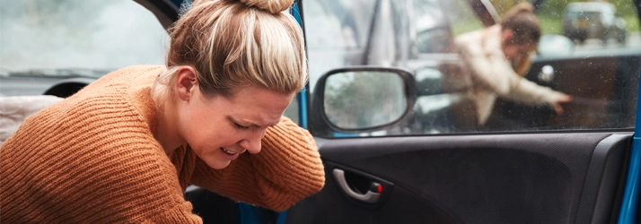 Chiropractic Rancho Bernardo CA Car Accident A woman holding her neck after a car accident.